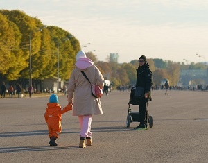 People walking in the park. Image credit: istock.com/YuryKaramanenko